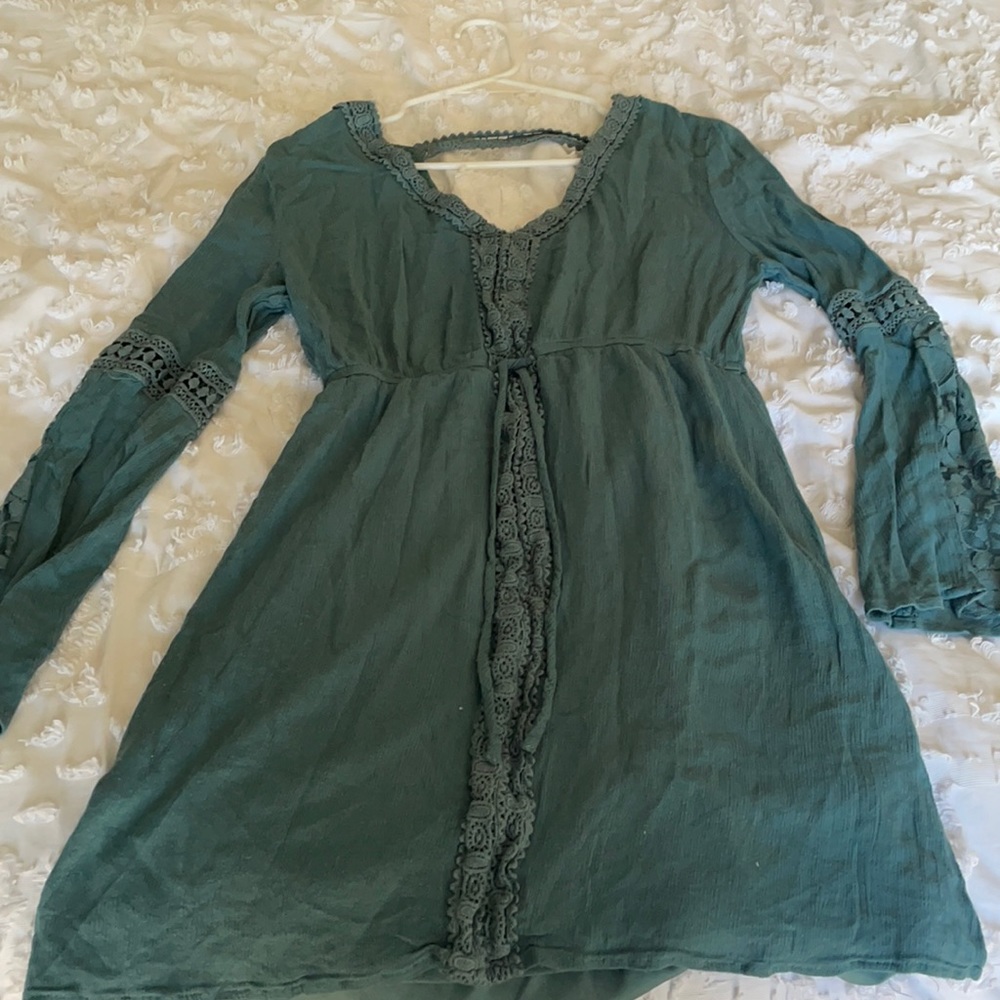 Blue long sleeve open back dress